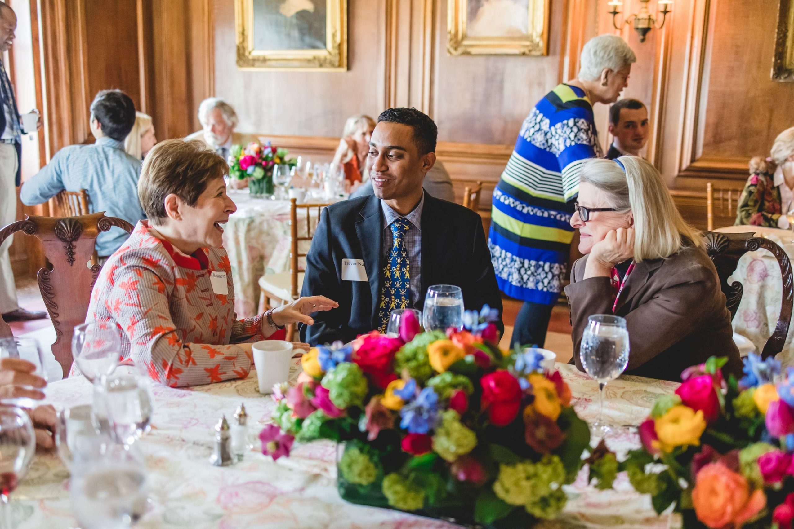 New Scholar chats with Alumni at the welcome luncheon in April 2022