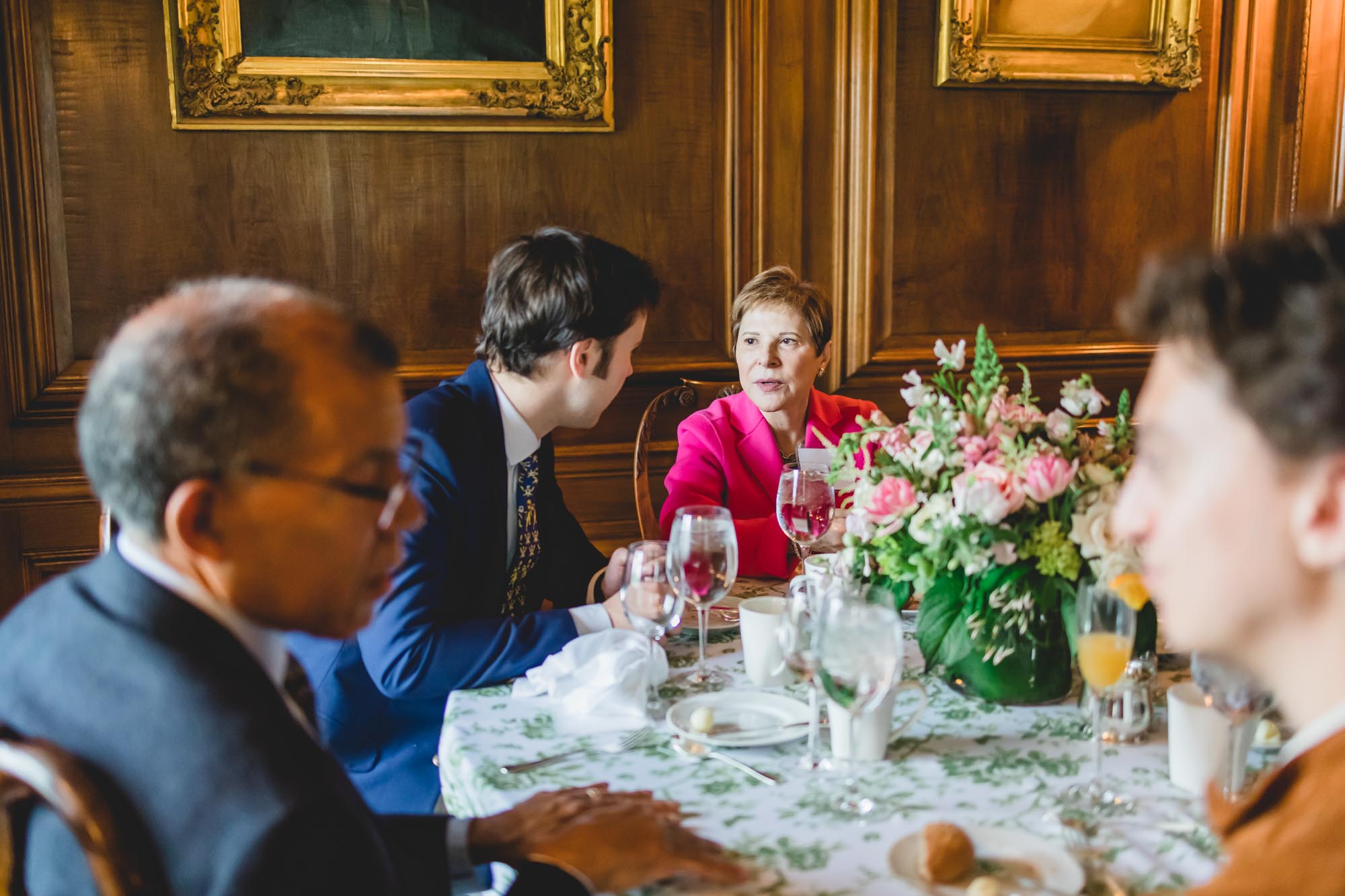 New Scholar meets Alumni while seated at the dining table at the welcome luncheon