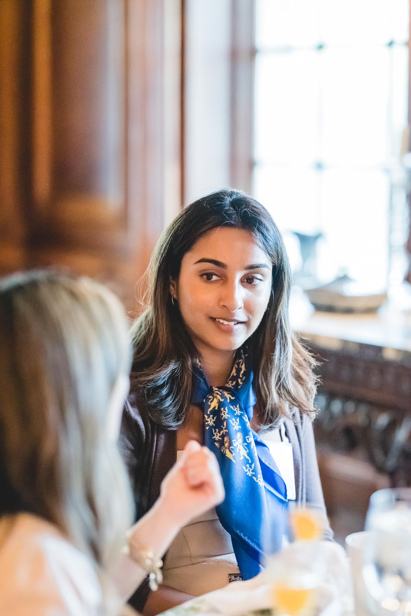 New Scholar wears their Thouron Award scarf while meeting other new Scholars