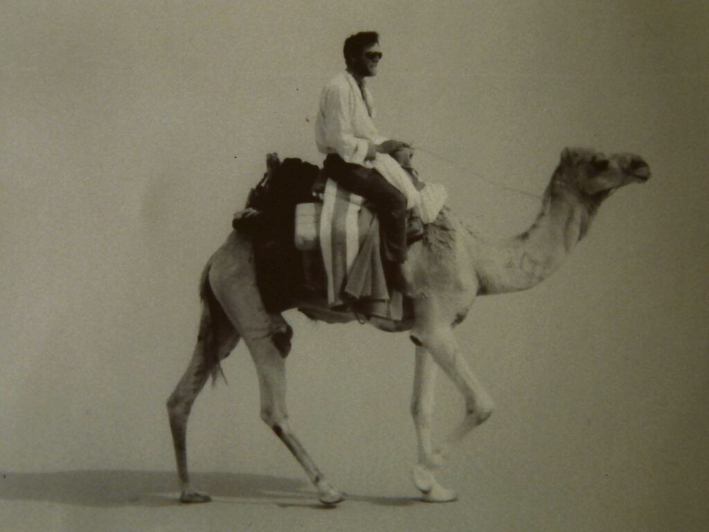Justin rides his favourite camel Asfar as he travels through the Libyan Sahara desert