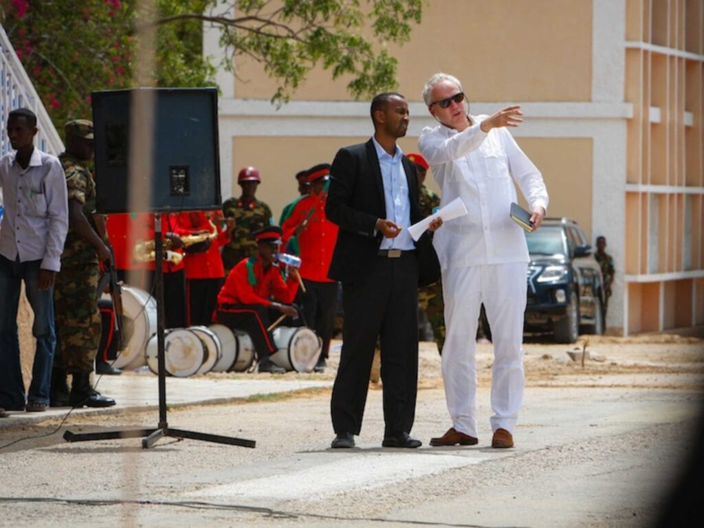 Justin talks with his colleague Malik Abdalla while working in Mogadishu, Somalia.